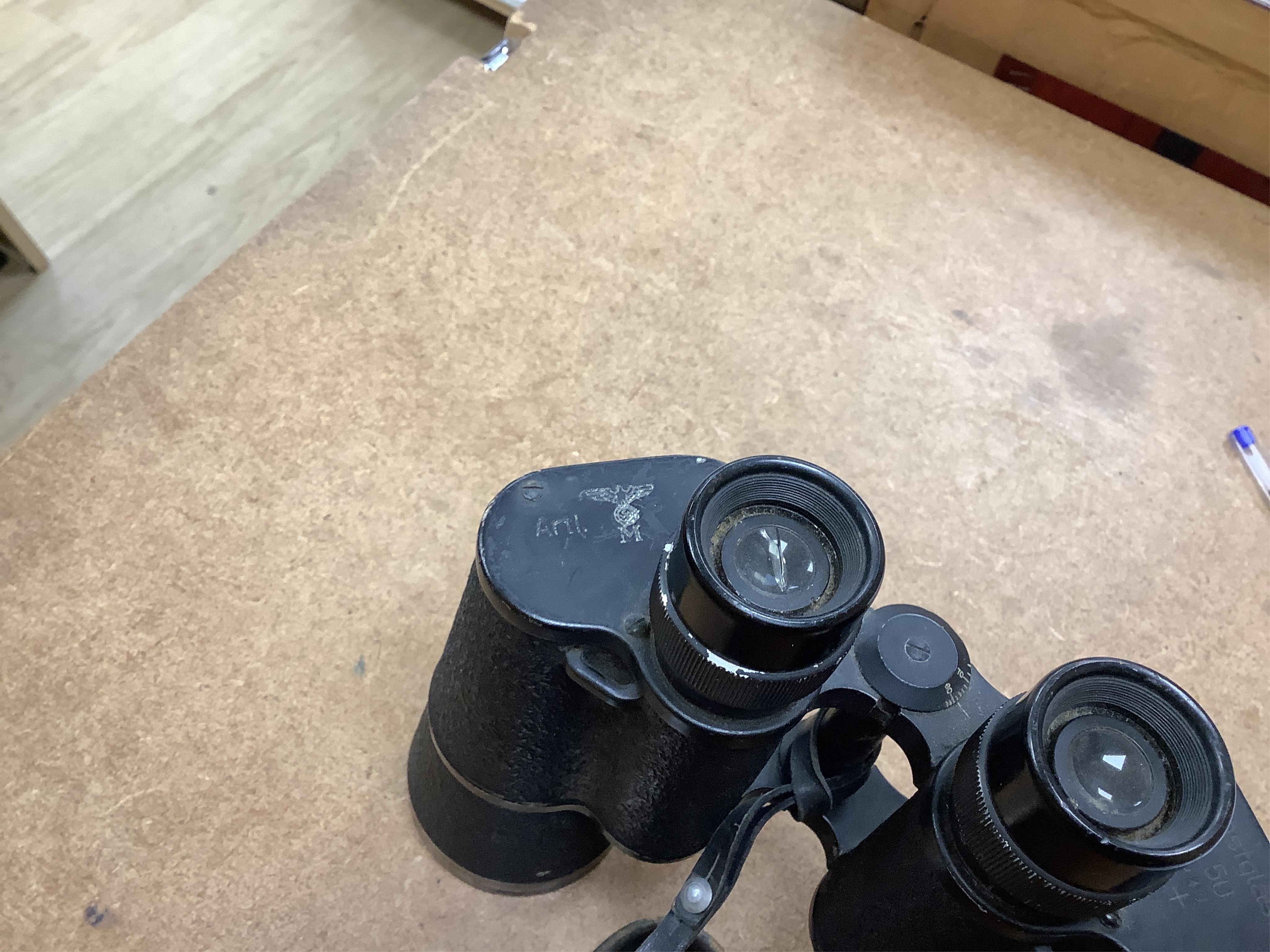 A pair of World War II German military binoculars, 17.5cm long. Condition - worn